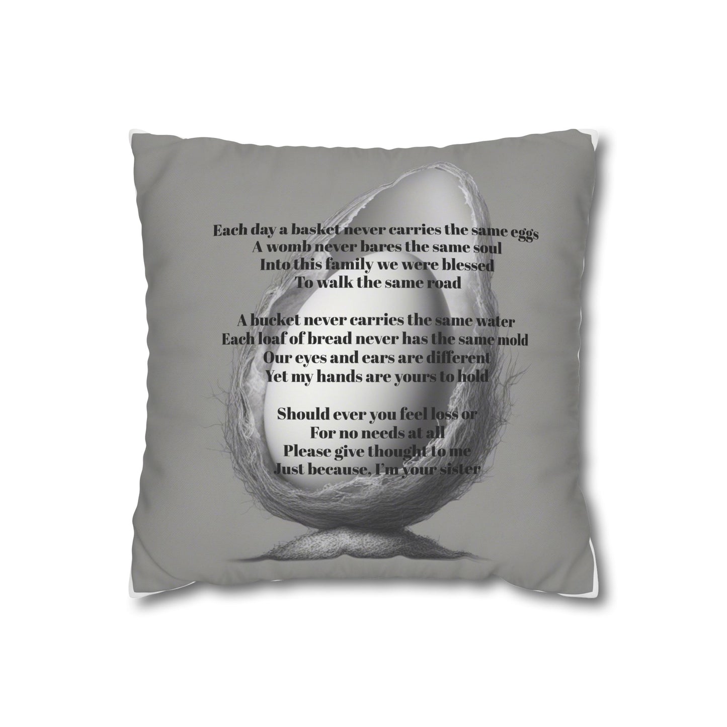Gray pillow with text and a graphic of a nest holding an egg on a white background with an Olga Foreign poem