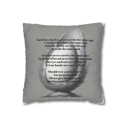Gray pillow with text and a graphic of a nest holding an egg on a white background with an Olga Foreign poem