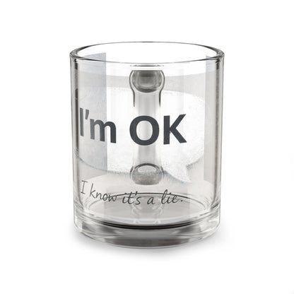 Clear glass mug with text 'I'm OK, I know it's a lie' on a white background